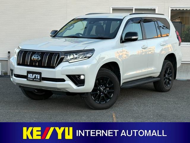 ランドクルーザープラド(トヨタ) ＴＸ　Ｌパッケージ　７０ｔｈアニバーサリーリミテッド　７人乗　【４ＷＤディーゼル】後期【ワンオーナー禁煙車】【パノラミックビューモニター／メーカーナビ】【茶革シート／ベンチレーションシート】【専用１８インチ黒アルミ／ルーフレール】【追従クルコン】【前後ドラレコ】 中古車画像