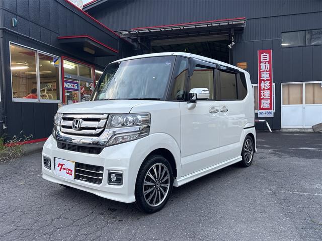 Ｎ－ＢＯＸカスタム Ｇ・ターボＬパッケージ　４ＷＤ　ＥＴＣ　バックカメラ　両側電動スライドドア　ナビ　ＴＶ　オートクルーズコントロール　オートライト　ＨＩＤ　スマートキー　アイドリングストップ　電動格納ミラー　シートヒーター　ベンチシート（1枚目）