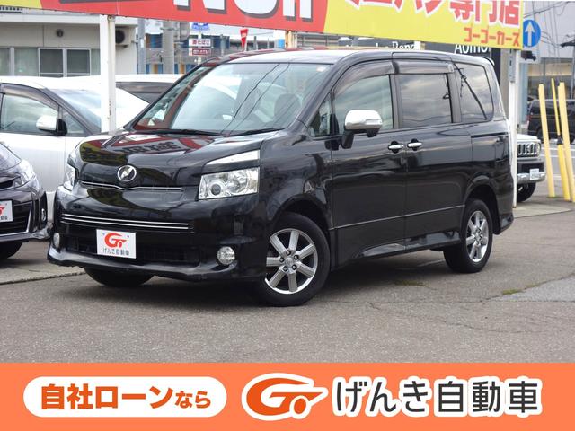 ヴォクシー(トヨタ) ＺＳ　煌ＩＩ　４ＷＤ　両側電動スライドドア　バックカメラ　純正ＨＤＤナビ　フルセグＴＶ　ＣＤ／ＤＶＤ再生　後席フリップダウンモニター　パドルシフト　ＥＴＣ　スマートキー　電動格納ミラー　ＨＩＤヘッドライト　フォグランプ 中古車画像