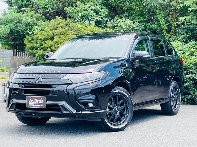 アウトランダーＰＨＥＶ Ｇプラスパッケージ　新品ＴＯＹＯオープンカントリー／新品ナイトロパワー１８インチ／純正８インチナビ／フルセグＴＶ／アラウンドビューモニター／ステアリングヒーター／前席シートヒーター　／レーダークルーズコントロール（1枚目）