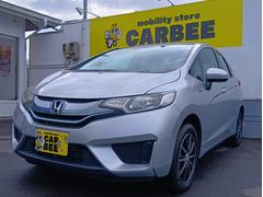 フィットハイブリッド Fパッケージ カロッツェリア製SDワンセグナビ バックカメラ スマートキー オートAC VSA横滑り防止 ミラーヒーター 電格ウィンカーミラー ヘッドライトレベライザー 15インチアルミ ワイパーデアイサー ETC 中古車画像