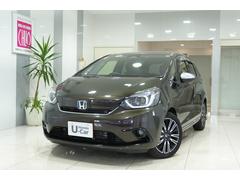 フィット e:HEVリュクス ホンダセンシング 横滑り防止装置 障害物センサー ドライブレコーダー ナビ バックカメラ ETC ワイヤレス充電器 LEDヘッドライト ステアリングヒーター アルミホイール スマートキー 中古車画像