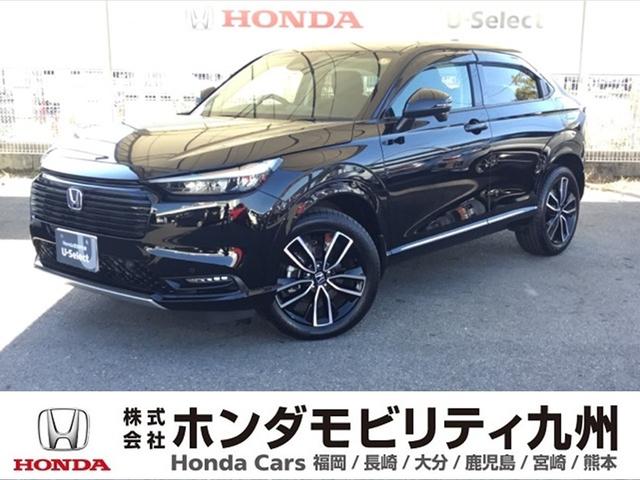 ヴェゼル(ホンダ) ｅ：ＨＥＶＺ　デモカー　ＢＳＩ　ＥＴＣ２．０　前後ドラレコ　シート＆ステアリングヒーター　電動リアゲート　衝突回避支援ブレーキ機能　スマキ　Ｐトランク　フルオートエアコン　Ｄレコ　エアバッグ　両席エアバック　Ｒカメ 中古車画像