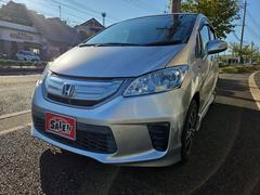 フリードハイブリッド ジャストセレクション ETC オートクルーズコントロール 両側スライド・片側電動 HID 電動格納ミラー 3列シート CVT アルミホイール 盗難防止システム ABS ESC エアコン パワーステアリング パワーウィンドウ 中古車画像