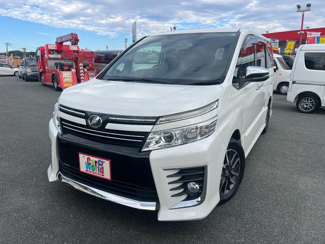 ヴォクシー(トヨタ) ＺＳ　煌　ドライブレコーダー　ＥＴＣ　バックカメラ　ナビ　ＴＶ　両側電動スライドドア　オートライト　ＬＥＤヘッドランプ　スマートキー　アイドリングストップ　３列シート　ＣＶＴ　アルミホイール　盗難防止システム 中古車画像