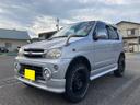 テリオスキッド カスタムＸ　４ＷＤ　リフトアップサスペンション　キーレスエントリー　電動格納ミラー　ＡＴ　ＡＢＳ　ＣＤ　ＭＤ　アルミホイール　衝突安全ボディ　エアコン　パワーステアリング　パワーウィンドウ　タイミングベルト交換済（1枚目）