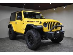 ジープ・ラングラー ルビコン ヘラヤライエロー リフトアップ ニトロチャージャースポーツショック BFGOODRICH35インチタイヤ KMCホイール DV8 Offroadバンパー スペアタイヤレス 中古車画像
