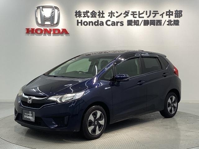 フィットハイブリッド(ホンダ) Ｆパッケージ／１年保証／禁煙車／１オ−ナ−　ナビＶＸＭ−１７４ＶＦＸｉ／ＴＶ／Ｒカメラ／ＤＶＤ／ＣＤ／Ｂｌｕｅｔｏｏｔｈ／ＵＳＢ／ｉＰｏｄ／ＳＤ／ＡＵＸ／ＥＴＣ／Ｆパケ／電動格納ミラー／オートリトラミラー／アームレスト付Ｓコンソールボックス 中古車画像