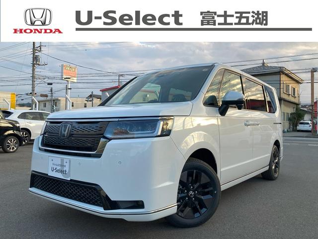 ステップワゴン(ホンダ) スパーダ ウォークスルー クルーズコントロール パワーゲート シートヒータ キーレスエントリー バックモニター アイドリングストップ サイドエアバッグ LEDヘッドランプ オットマン スマートキー 中古車画像