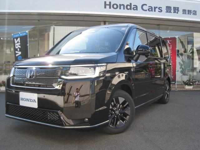 ステップワゴン(ホンダ) ｅ：ＨＥＶスパーダ　１１．４インチ純正ナビ　バックカメラ　ホンダコネクト　ホンダセンシング　バックカメラ　オットマン　ハーフレザー　シートヒーター　ＬＥＤオートライト　パーキングセンサー　７人乗　フロアマット　デモカー 中古車画像