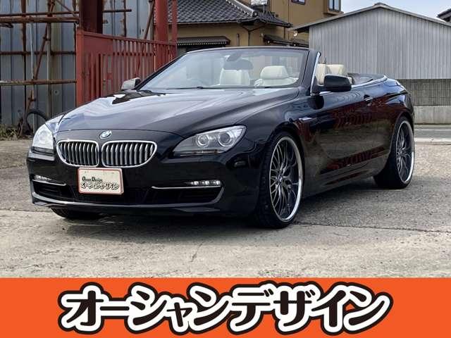 沖縄県の中古車なら６シリーズ ６４０ｉカブリオレ　ＨＤＤナビ　ＣＤ　ＤＶＤ　オーディオ　バックカメラ　盗難防止システム　スマートキー　多機能ハンドル　プッシュスタート　ＨＩＤ　ターボ　電動ルーフ　社外マフラー　ホワイトレザー