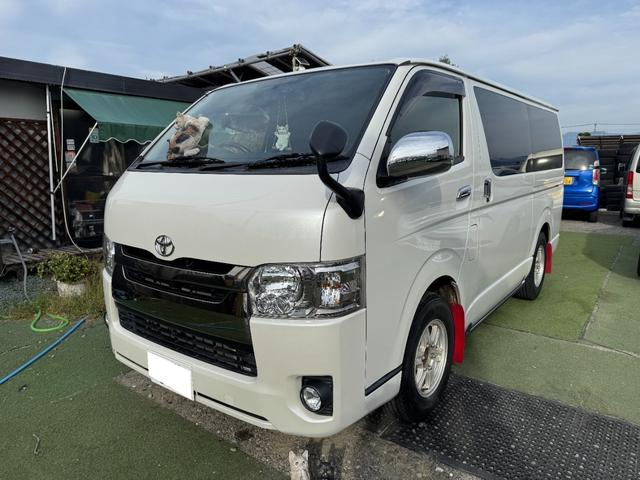 レジアスエースバン スーパーＧＬ　ダークプライム　１オーナー／４ＷＤ／ディーゼル／プッシュスタート／両側パワスラ／寒冷地仕様／バックモニター／ＡＣ１００Ｖ／助手席エアバック／ＬＳＤ／パナソニックナビ／ドライブレコーダー／ＥＴＣ２．０／リヤフィルム施工（1枚目）