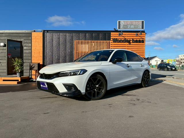 シビック(ホンダ) ｅ：ＨＥＶ　ワンオーナー　テールゲートスポイラー　ハーフレザー　純正ナビ　フルセグ　Ｂｌｕｅｔｏｏｔｈ　アップルカープレイ　バックカメラ　ステアリモコン　クルコン　シートヒーター　コーナーセンサー　ＥＴＣ 中古車画像