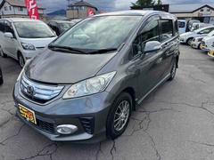 フリードハイブリッド ハイブリッド バックカメラ 車検令和9年10月まで ナビ 両側スライド・片側電動 キーレス 電動格納ミラー CVT アルミホイール 3列シート ウォークスルー ABS ESC エアコン パワーステアリング パワステ 中古車画像