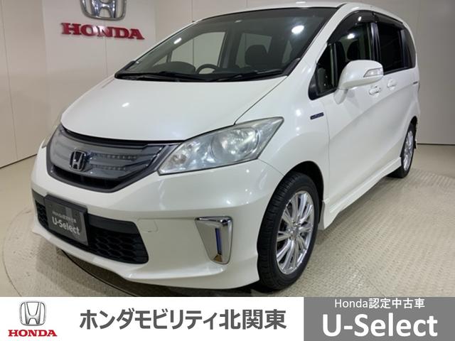 フリードハイブリッド(ホンダ) ジャストセレクション　フル装備ＨＤＤナビＲカメラスマートキーＨＩＤ　盗難警報装置　ＶＤＣ　リアカメラ　インテリキー　ナビＴＶ　ウォークスルー　オートクルーズコントロール　３列シート　キーレスエントリー　パワーウィンドウ 中古車画像