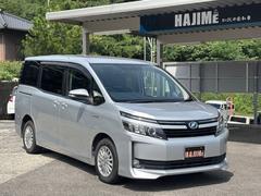 ヴォクシー ハイブリッドV ナビ フルセグTV バックカメラ ETC 後席モニター 両側パワースライドドア Bluetooth 純正アルミホイール クルーズコントロール スマートキー ワイヤレス充電器 シートヒーター 中古車画像
