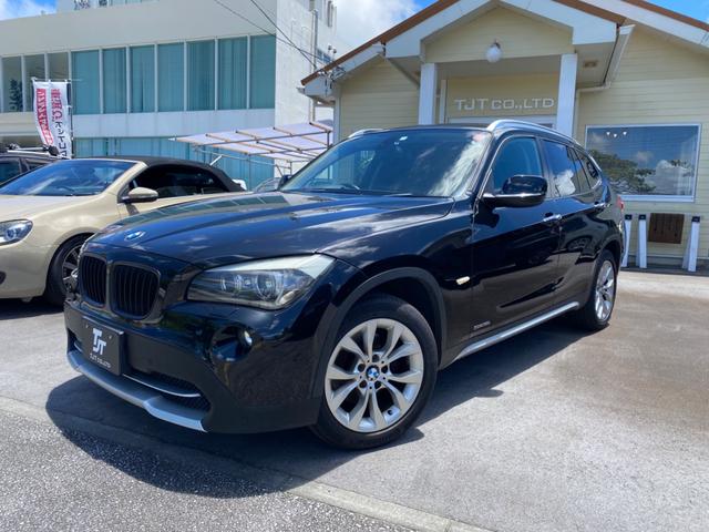 島尻郡与那原町 車買取のマルク　東浜店 ＢＭＷ Ｘ１ ｓＤｒｉｖｅ　１８ｉ　禁煙車　純正アルミホイール　ＨＩＤヘッドライト　オートライト　純正ナビ　Ｂｌｕｅｔｏｏｔｈ接続　プッシュスタート　スマートキー　前後ドラレコ ブラック 7.1万km 2011(平成23)年