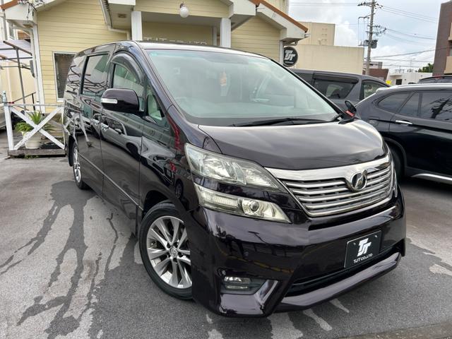 沖縄県の中古車ならヴェルファイア ２．４Ｚ　プラチナセレクションＩＩ　ＨＩＤ　フォグランプ　両側パワースライドドア　パワーバックドア　ナビ・ＴＶ　バックカメラ　ドラレコ　両側スライドドア　オットマン　ＥＴＣ