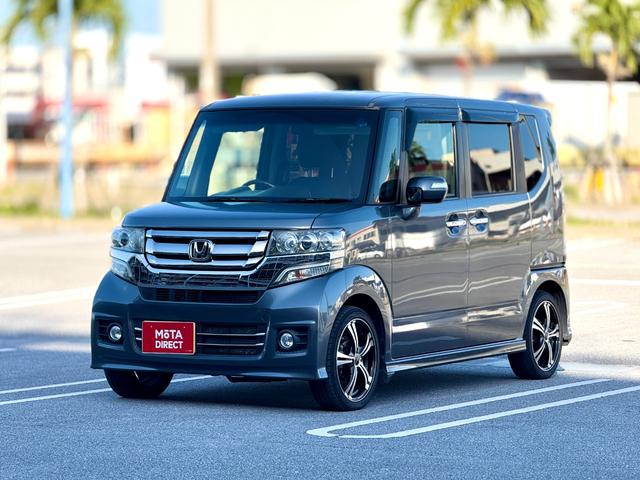 沖縄県の中古車ならＮ－ＢＯＸカスタム Ｇ・Ｌパッケージ　テレビ　電動格納ミラ－　アイドリングストップ車　スマキ－　フロントベンチシート　パワーウィンドウ　片側電動両側スライドドア　盗難防止システム　オートエアコン　パワステ　キーレスエントリー　ワンセグ