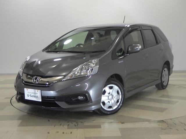 フィットシャトルハイブリッド(ホンダ) ハイブリッド VSA・HID・リアカメラ・ETC・キーレスキー・シートヒーター・禁煙車 フルセグ エアコン ESC 運転席助手席エアバック Rカメラ パワーステアリング 運転席エアバック クルコン ABS 中古車画像