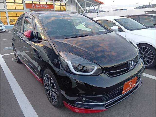 フィット(ホンダ) ｅ：ＨＥＶリュクス　後期型　禁煙車　モデューロエアロ　純正９インチナビ　ワイアレス充電　ホンダセンシング　レーダークルーズコントロール　ステヤリングヒーター　シートヒーター　フルセグ　クリアランスソナー　ＬＥＤ 中古車画像