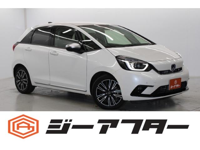 フィット(ホンダ) ｅ：ＨＥＶリュクス　ギャザズ９型ナビ　フルセグ　フロントバックカメラ　ワイヤレス充電　ステアリングヒーター　ホンダセンシング　レーダークルーズ　シートヒーター　クリアランスソナー　ＬＥＤヘッドライト　純正１６インチＡＷ 中古車画像