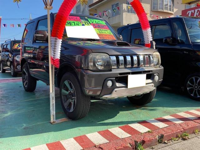 沖縄県の中古車ならジムニー ＸＣ　切替式４ＷＤ　社外ナビ　ワンセグ　純正アルミ　背面ハードカバー