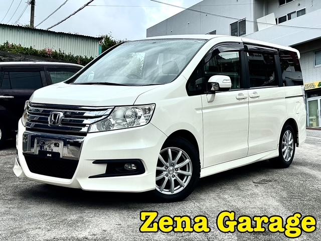 ステップワゴンスパーダ(ホンダ) S 2年保証付き 本土仕入 9インチワイドナビ 8名乗り シートカバー付き パワースライドドア、パドルシフト、革巻きステアリング、TV フリップダウンモニター、社外16インチアルミホイール リアスポイラー 中古車画像