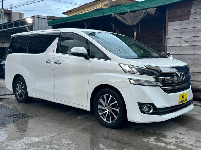 沖縄県の中古車ならヴェルファイア ２．５Ｖ　２．５Ｖ　ホワイトパール　純正ナビゲーション／バックカメラ／ビルトインＥＴＣ／フリップダウンモニター／純正１７インチＡＷ／Ｂｌｕｅｔｏｏｔｈ／フルセグＴＶ