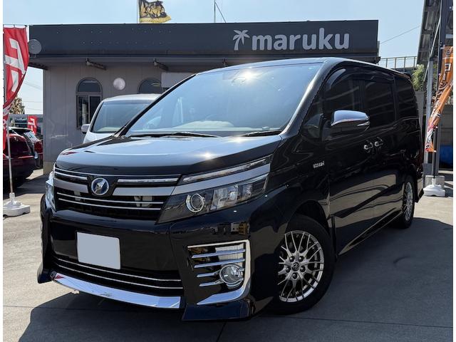 沖縄県の中古車ならヴォクシー ハイブリッドＺＳ　レーンアシスト　衝突軽減ブレーキ　両側パワースライド　フリップダウン　純正ナビ１０インチ　ＴＶ　ＤＶＤ　バックモニター　７人乗り　ＬＥＤヘットライト　フルフラット　スマートキー