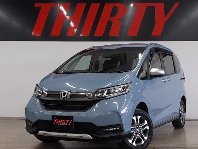 フリードハイブリッド(ホンダ) ハイブリッド・クロスターホンダセンシング　４ＷＤ　１オーナー　インターナビ　フルセグＴＶ　アダプティブクルコン　バックカメラ　前後ドライブレコーダー　シートヒーター　両側電動スライド　ＬＥＤフォグ　ＬＥＤヘッドライト 中古車画像