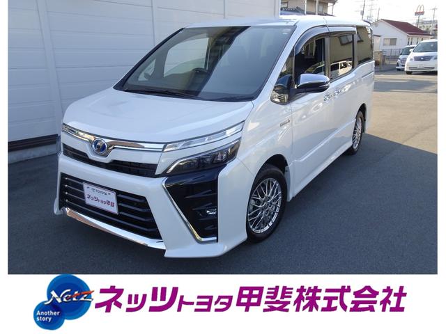 ヴォクシー(トヨタ) ハイブリッドZS 煌II 7人乗・TSS(対車両・歩行者)ICS・SDナビ・バックモニター・ETC・ドラレコ・両側パワースライドドア・シートヒーター・純正アルミホイール・クルーズコントロール・保証書・取説・ロングラン保証 中古車画像