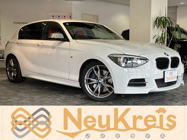 １シリーズ(BMW) Ｍ１３５ｉ　革シートセット　ダコタ革シート　シートヒーター　赤革シート　パワーシート　純正１８インチＡＷ　純正ナビ　地デジ　バックカメラ　ディーラー記録簿Ｈ２８．２９．２９．．Ｒ１．Ｒ３．Ｒ５有 中古車画像