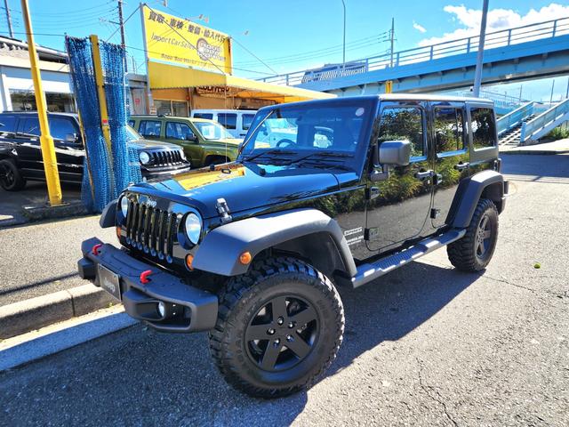 ジープ・ラングラーアンリミテッド(ジープ) スポーツ　新品２インチリフトキット　新品ＭＴタイヤ　純正ＡＷブラック加工　ＵＳナンバーブラケット　新品ルビコンタイプバンパー　　ストラーダナビフルセグバックカメラＥＴＣ　純正キーレス２個 中古車画像