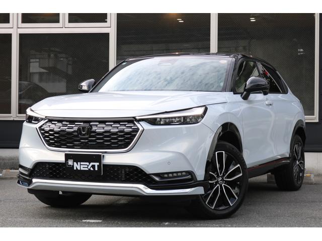 ヴェゼル(ホンダ) ｅ：ＨＥＶ　ＰＬａＹ　禁煙車　ホンダセンシング　純正ナビ　パノラミックビューモニター　パノラマルーフ　　ハーフレザーシート　ツートンルーフ　パワーバックドア　ＢＳＭ　クリアランスソナー　ハーフレザーシート　シートヒーター 中古車画像