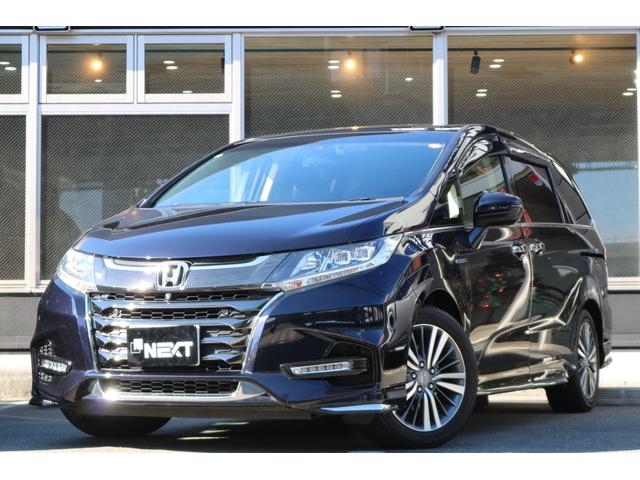 オデッセイハイブリッド(ホンダ) ハイブリッドアブソルート・ＥＸホンダセンシング　純正ナビ　フルセグＴＶ　両側自動ドア　フリップダウンモニター　　黒革シート　ＬＥＤヘッド　ＢＳＭ　クルコン　シートヒーター　パワーシート　ホンダセンシング　マルチビューカメラ 中古車画像