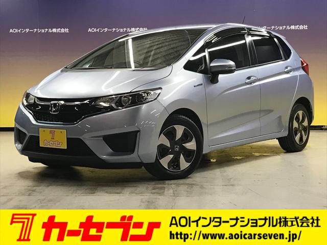 フィットハイブリッド(ホンダ) Ｌパッケージ　インターナビセット／純正ナビ／バックカメラ／フルセグＴＶ／ＣＤ／ＤＶＤ／ＢＴオーディオ／ＵＳＢ／ＨＤＭＩ／AftermarketＨＫＳマフラー／衝突軽減ブレーキ／前方ドラレコ／クルコン／合皮コンビシート／ＥＴＣ 中古車画像