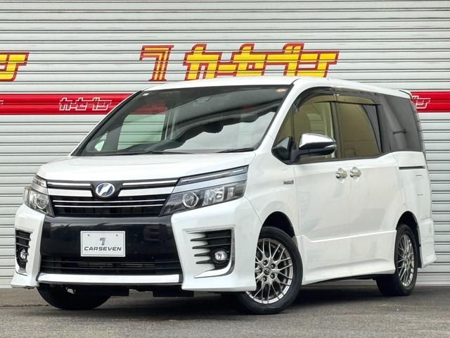 ヴォクシー(トヨタ) ハイブリッドＺＳ　煌ＩＩ　セーフティセンスＣ　純正９インチナビ　フルセグＴＶ　バックカメラ　両側パワスラ　ＬＥＤオートライト　ＬＥＤフォグ　オートハイビーム　ＥＴＣ 中古車画像