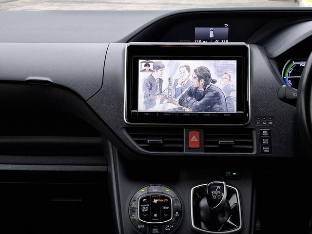 ヴォクシー ハイブリッドＶ　禁煙車　両側パワースライド　オートライト　ＬＥＤライト　シートヒーター　スマートキー　デュアルエアコン　９型ナビ　フルセグＴＶ　Ｂｌｕｅｔｏｏｔｈ　バックカメラ　ＥＴＣ　１１型フリップダウン　クルコン（13枚目）