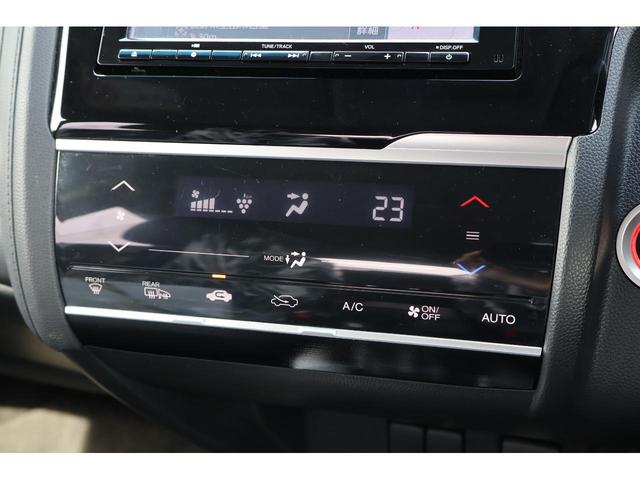 フィットハイブリッド Ｌ　ホンダセンシング　ハーフレザーシート　バックモニター　Ｈｏｎｄａ　ＳＥＮＳＩＮＧ　純正ナビ　フルセグＴＶ　ＬＥＤヘッドライト　ＬＥＤフォグライト　ビルトインＥＴＣ　　サイド＆カーテンエアバック　Ｂｌｕｅｔｏｏｔｈ（16枚目）