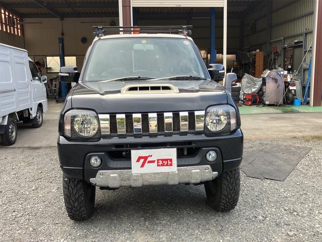 ジムニー クロスアドベンチャー 4WD 5速マニュアル リフトアップ CD/MD ETC シートヒーター キーレスエントリー 衝突安全ボディ 16インチアルミ ライトレベライザー ウインカー付き電動格納ドアミラー メッキグリル(3枚目)