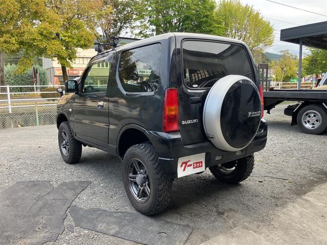ジムニー クロスアドベンチャー 4WD 5速マニュアル リフトアップ CD/MD ETC シートヒーター キーレスエントリー 衝突安全ボディ 16インチアルミ ライトレベライザー ウインカー付き電動格納ドアミラー メッキグリル(9枚目)