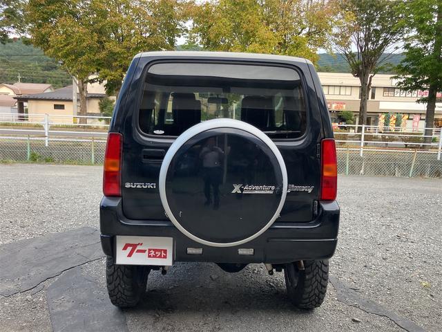 ジムニー クロスアドベンチャー 4WD 5速マニュアル リフトアップ CD/MD ETC シートヒーター キーレスエントリー 衝突安全ボディ 16インチアルミ ライトレベライザー ウインカー付き電動格納ドアミラー メッキグリル(11枚目)