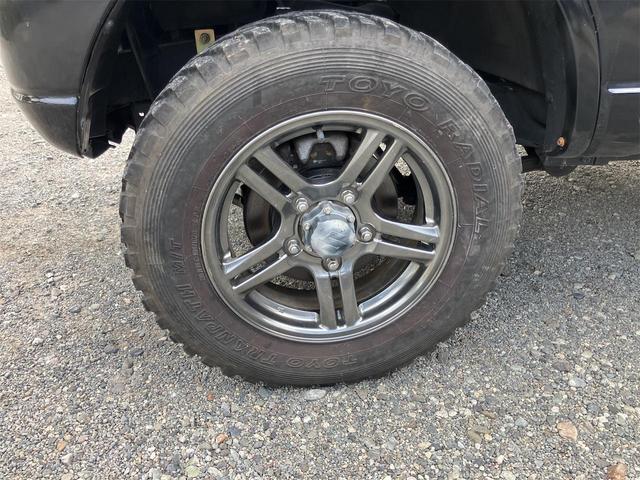 ジムニー クロスアドベンチャー 4WD 5速マニュアル リフトアップ CD/MD ETC シートヒーター キーレスエントリー 衝突安全ボディ 16インチアルミ ライトレベライザー ウインカー付き電動格納ドアミラー メッキグリル(21枚目)