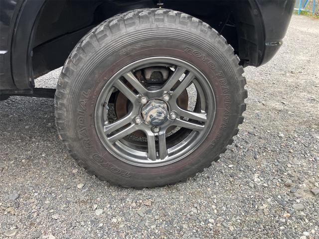 ジムニー クロスアドベンチャー 4WD 5速マニュアル リフトアップ CD/MD ETC シートヒーター キーレスエントリー 衝突安全ボディ 16インチアルミ ライトレベライザー ウインカー付き電動格納ドアミラー メッキグリル(22枚目)