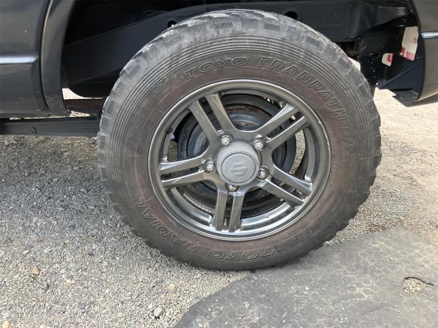 ジムニー クロスアドベンチャー 4WD 5速マニュアル リフトアップ CD/MD ETC シートヒーター キーレスエントリー 衝突安全ボディ 16インチアルミ ライトレベライザー ウインカー付き電動格納ドアミラー メッキグリル(24枚目)