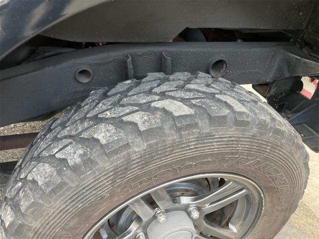 ジムニー クロスアドベンチャー 4WD 5速マニュアル リフトアップ CD/MD ETC シートヒーター キーレスエントリー 衝突安全ボディ 16インチアルミ ライトレベライザー ウインカー付き電動格納ドアミラー メッキグリル(25枚目)