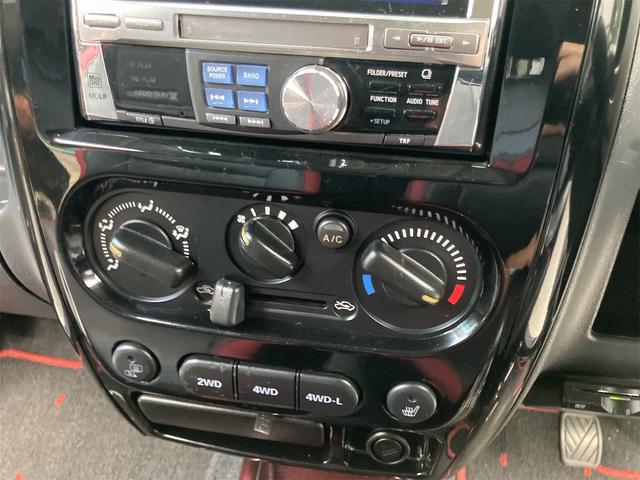 ジムニー クロスアドベンチャー 4WD 5速マニュアル リフトアップ CD/MD ETC シートヒーター キーレスエントリー 衝突安全ボディ 16インチアルミ ライトレベライザー ウインカー付き電動格納ドアミラー メッキグリル(44枚目)