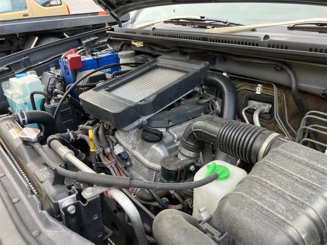 ジムニー クロスアドベンチャー 4WD 5速マニュアル リフトアップ CD/MD ETC シートヒーター キーレスエントリー 衝突安全ボディ 16インチアルミ ライトレベライザー ウインカー付き電動格納ドアミラー メッキグリル(59枚目)