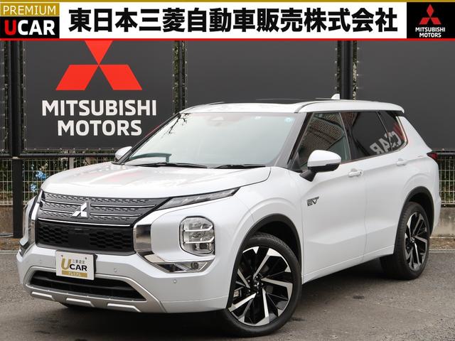 アウトランダーＰＨＥＶ Ｐ　禁煙車　７人乗り　パノラマサンルーフ　ＢＯＳＥスピーカー　ＡＣ１５００Ｗ１００Ｖ電源　衝突被害軽減　車線逸脱警報　後側方車両検知　誤発進抑制機能　全方位カメラ　フロントシートヒーター　本革シート（1枚目）